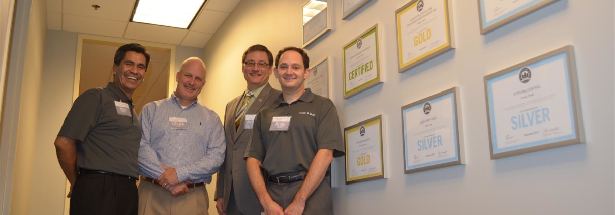Group photo to represent that Jordan & Skala’s Dallas Office is USGBC LEED Silver Certified