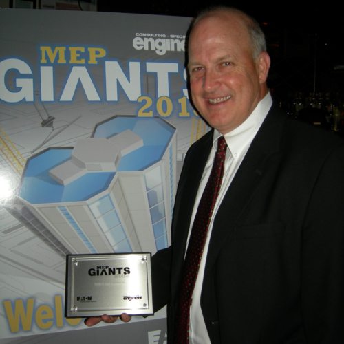 Image of a man holding an award to represent sustainability design firm, Jordan & Skala Engineers, ranking 53 on the 2013 MEP Giants list.