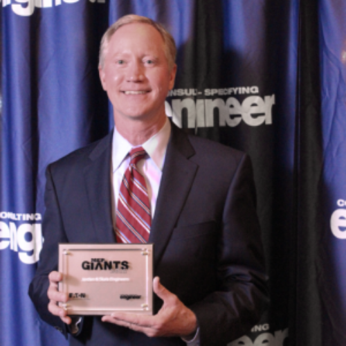 Image of Don Sheffield holding 2017 MEP Giants trophy